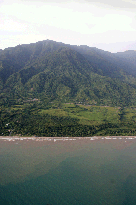 Granadita Horizon — aerial view of Caribbean coastline, tropical terrain, and mountain backdrop, Atlántida Honduras